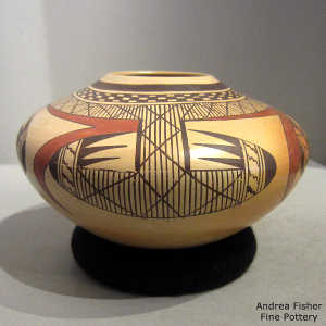 Bird element and geometric design on a polychrome yellow ware jar