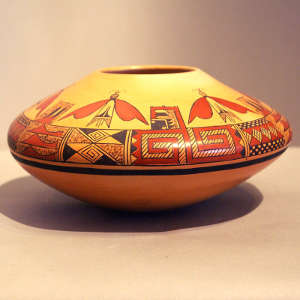 Red and black moth and geometric design on a yellowware jar