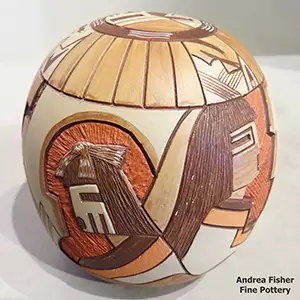 Lightly carved, sgraffito and painted katsina and geometric design on a polychrome seed pot