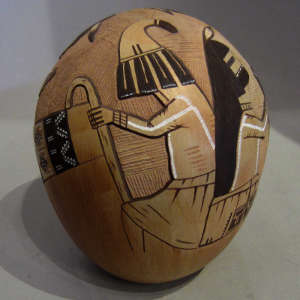 Images of four kachinas doing a blessing ceremony carved on a pot