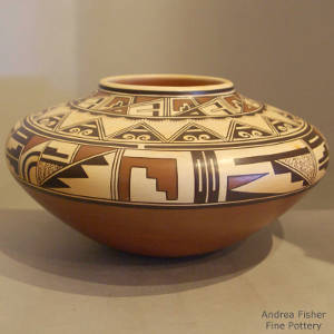 Shard and geometric designs on a polychorme Zuni-style jar