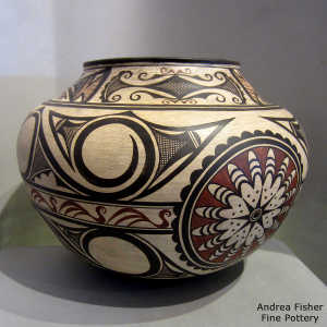 Zuni bird, rosette and geometric design on a polychrome jar