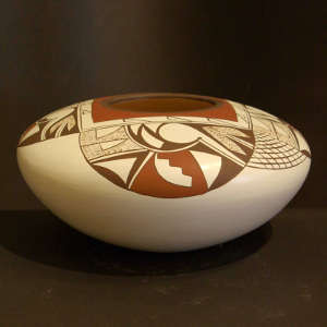 Black and red shard designs on a whiteware jar