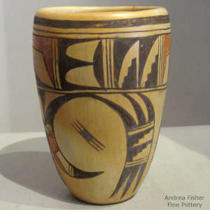 Red and black bird element and medium shard design outside, polished inside on this yellowware cylinder