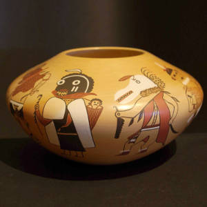 Ogre kachina desings on the outside and child design on the inside of a yellow ware jar