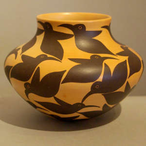 Hummingbird design on a yellow ware jar