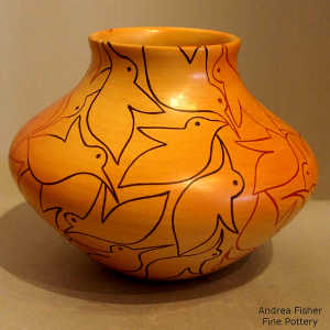 Bird design and fire clouds on a yellow ware jar