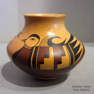 Bird element and geometric design on a polychrome jar with fire clouds