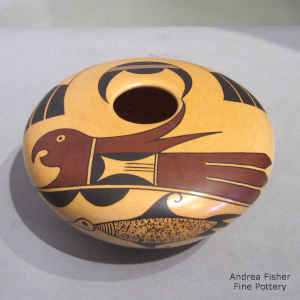 Bird element and geometric design plus fire clouds on a polychrome Sikyatki-style seed pot