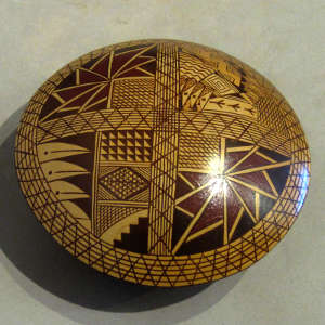 Geometric design on a yellow ware seed pot