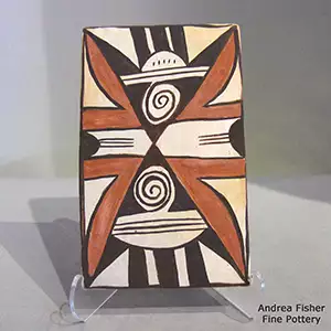 A spiral and geometric design on a polychrome tile