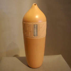 Carved shifting sands design and inlaid silver on a polished buff cylinder