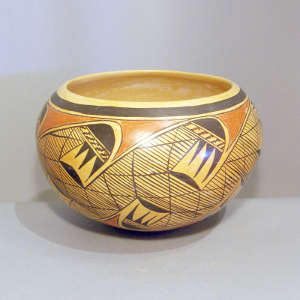 Black and red migration pattern on a yellowware bowl