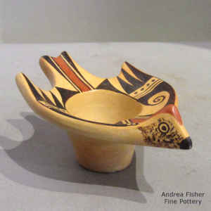Bird element and geometric design on a polychrome bird effigy