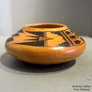 Bird element and geometric design on a polychrome yellow ware bowl