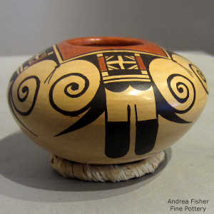 Eagletail and geometric design on a polychrome yellow ware jar