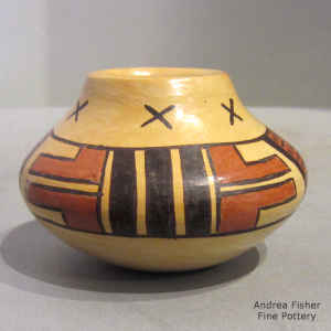 Geometric design on a miniature polychrome jar with fire clouds