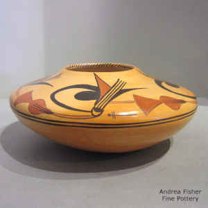 Fire clouds and a geometric design on a polychrome jar