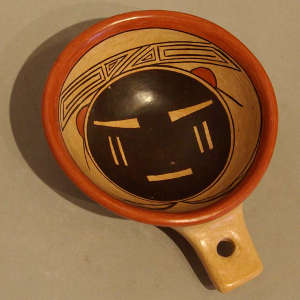 Sun face on a polychrome ladle