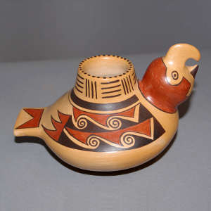 Polychrome parrot effigy jar with a bird element and geometric design