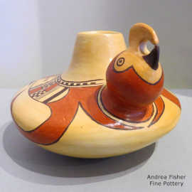 Bird element and geometric design on a polychrome bird effigy