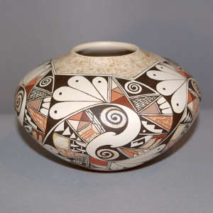 Shard and geometric design on a polychrome white ware jar