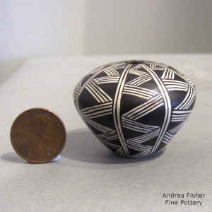 Geometric design on a miniature black and white seed pot