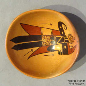 Bird element and geometric design inside and geometric design outside on a polychrome yellow ware bowl with fire clouds