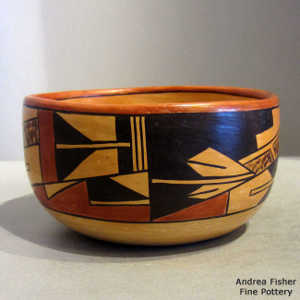 Bird element and geometric design on a polychrome yellow ware bowl