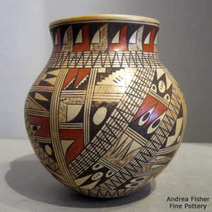 Medium shard and geometric design on a polychrome jar with a polished interior