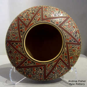 Small shard and geometric design on a low-shouldered polychrome jar