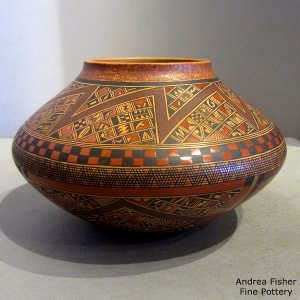 Small shard and geometric design on a polychrome jar with a polished interior
