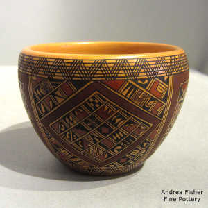 Small shard and geometric design on a polychrome yellow ware jar