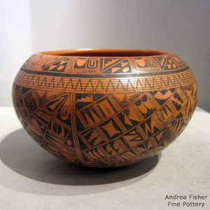 Medium shard and geometric design on a red bowl polished inside and out