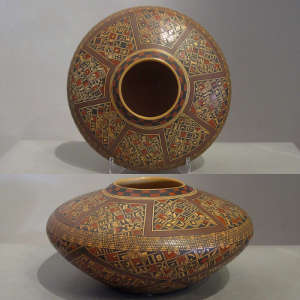 Fine shard and geometric design on a polychrome jar