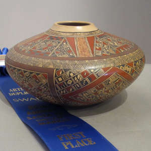 Fine shard and geometric design on a polychrome jar