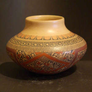 Fine shard and geometric design on a polychrome yellowware jar