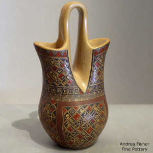 Fine shard and geometric design on a polychrome yellow ware wedding vase
