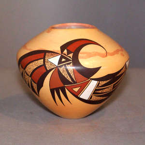 Bird element and geometric design on a polychrome marbled clay jar