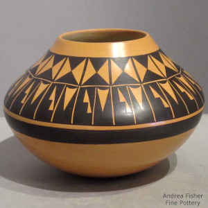 Black geometric design on a large Sikyatki-style seed pot