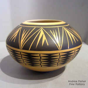Geometric design on a black on yellow jar