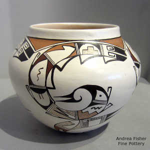 Bird element and geometric design on a white ware polychrome jar