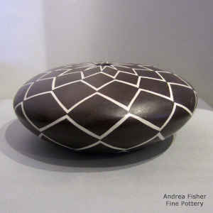 Geometric design on a black and white seed pot