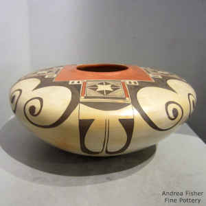 Eagletail and geometric design on a flat top polychrome pot