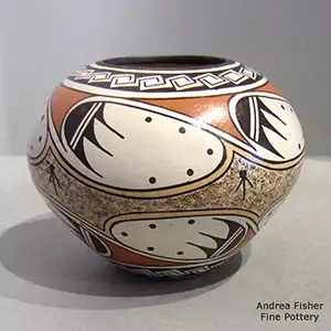 Polychrome jar with a bat wing, scroll and geometric design