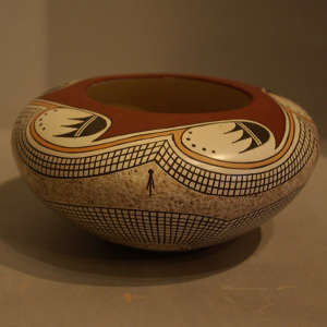 Bat wing and geometric designs on a polychrome jar