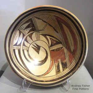 Bird-hanging-from-sky-band and geometric design on a polychrome bowl