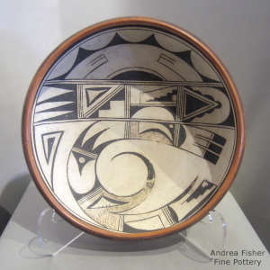 Bird element, shard and geometric design inside and out on a large polychrome bowl