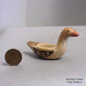 Bird element and geometric design on a miniature polychrome ladle
