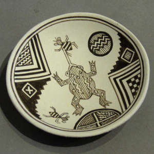 Black on white design on a tiny plate